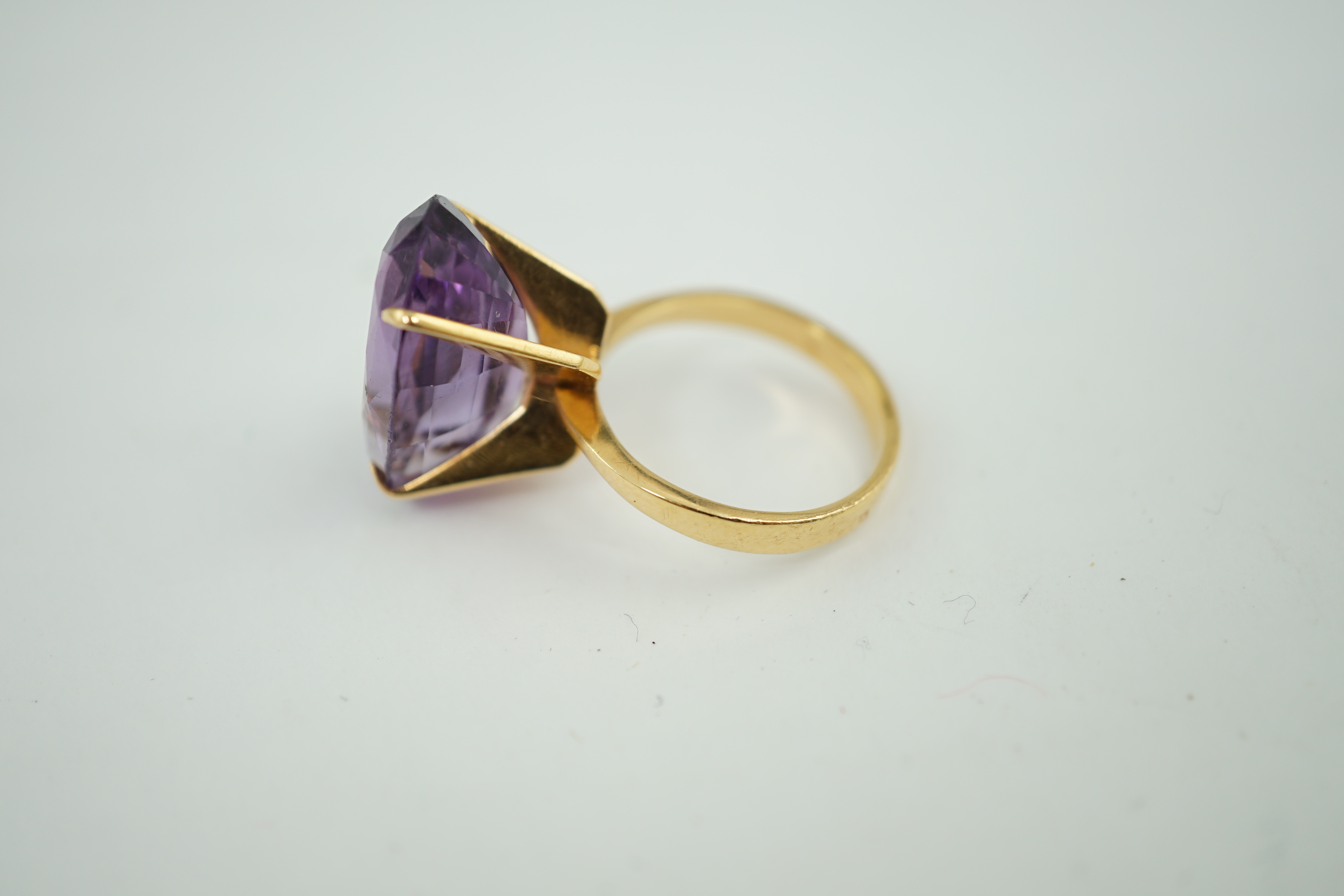 A mid 20th century French 18k gold and single stone oval cut amethyst set dress ring